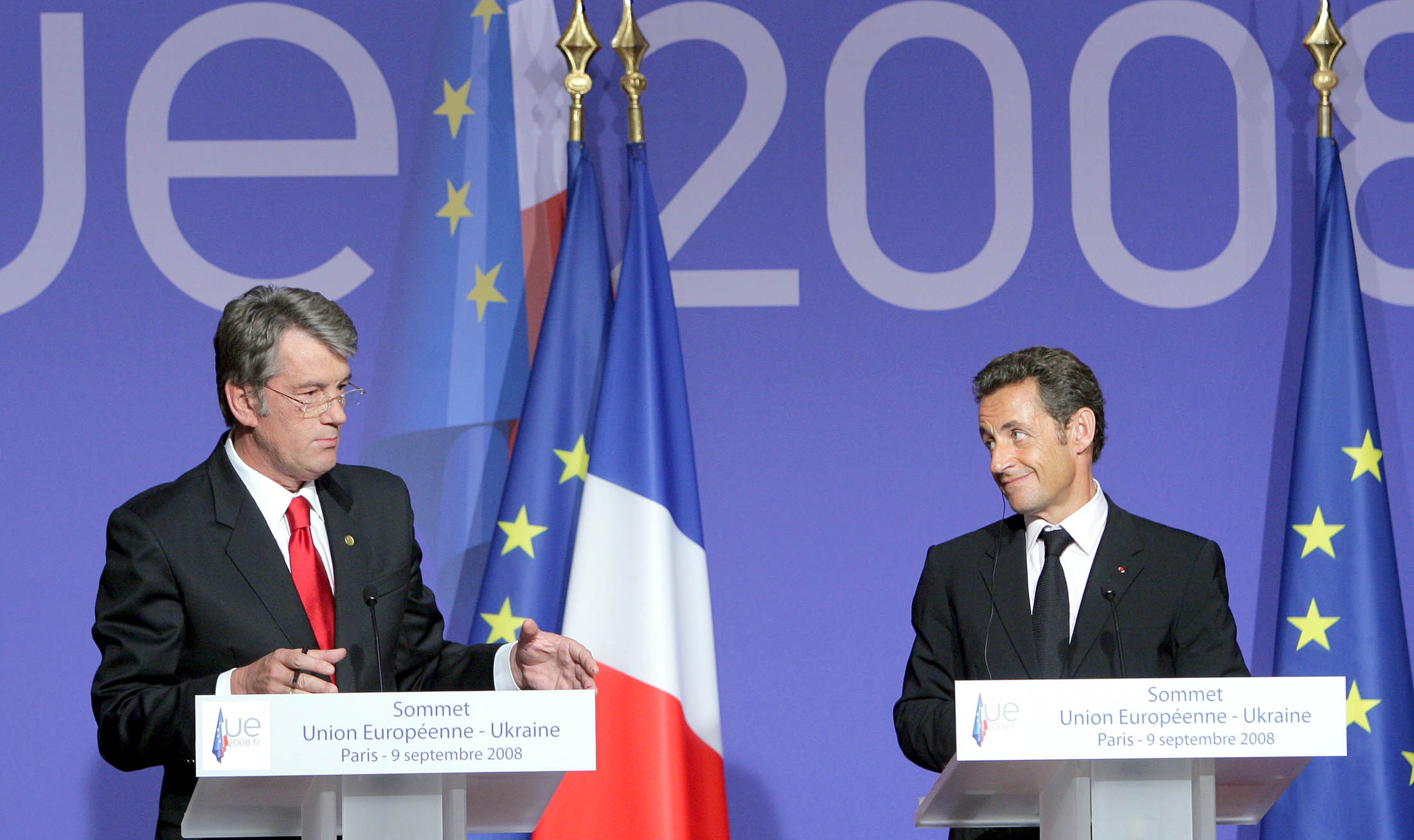 Nicolas Sarkozy to the right